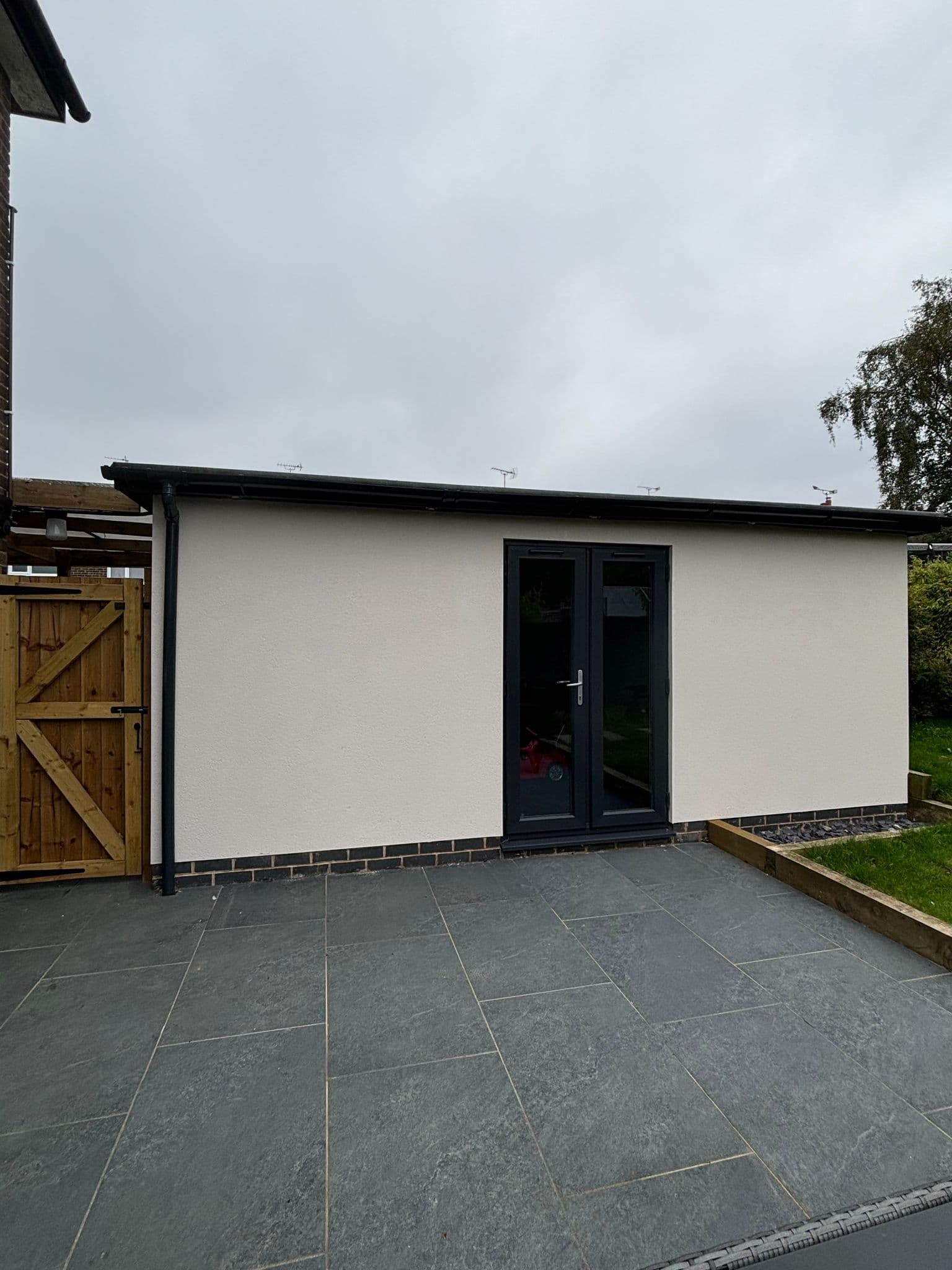 Image of garden with completed patio and garage build