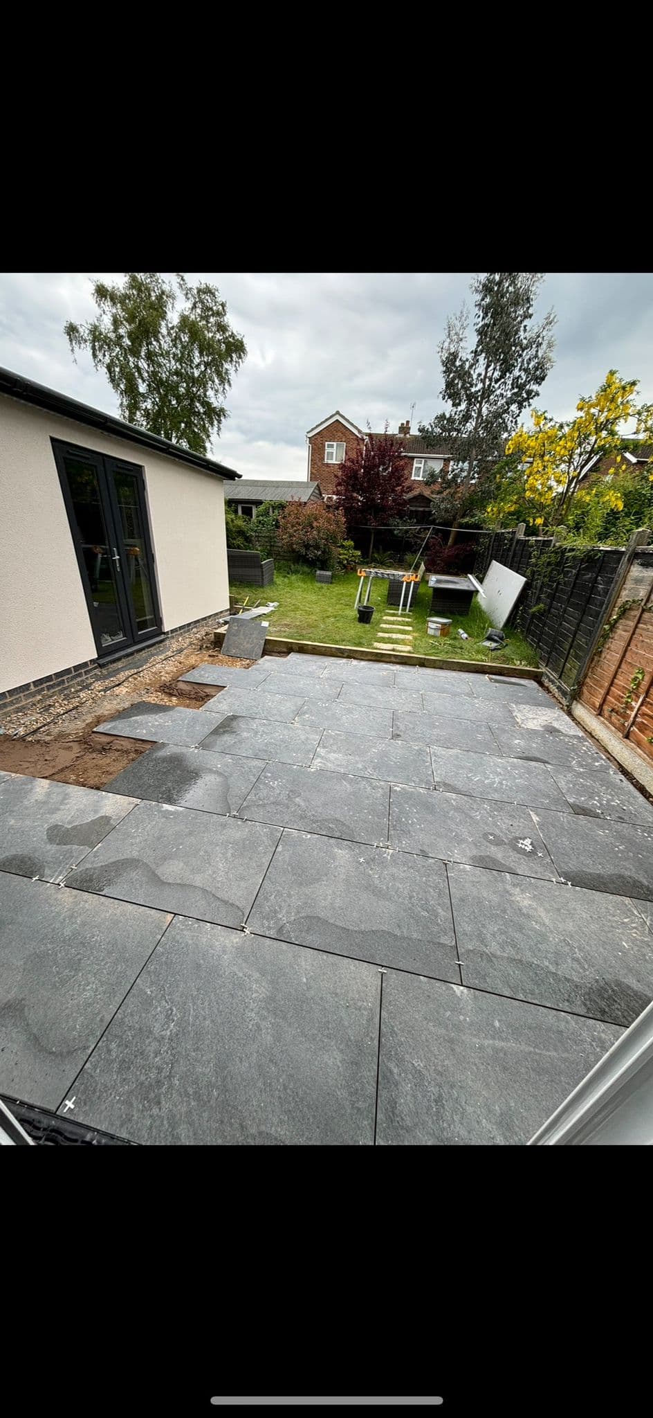 Stone patio slabs after being laid